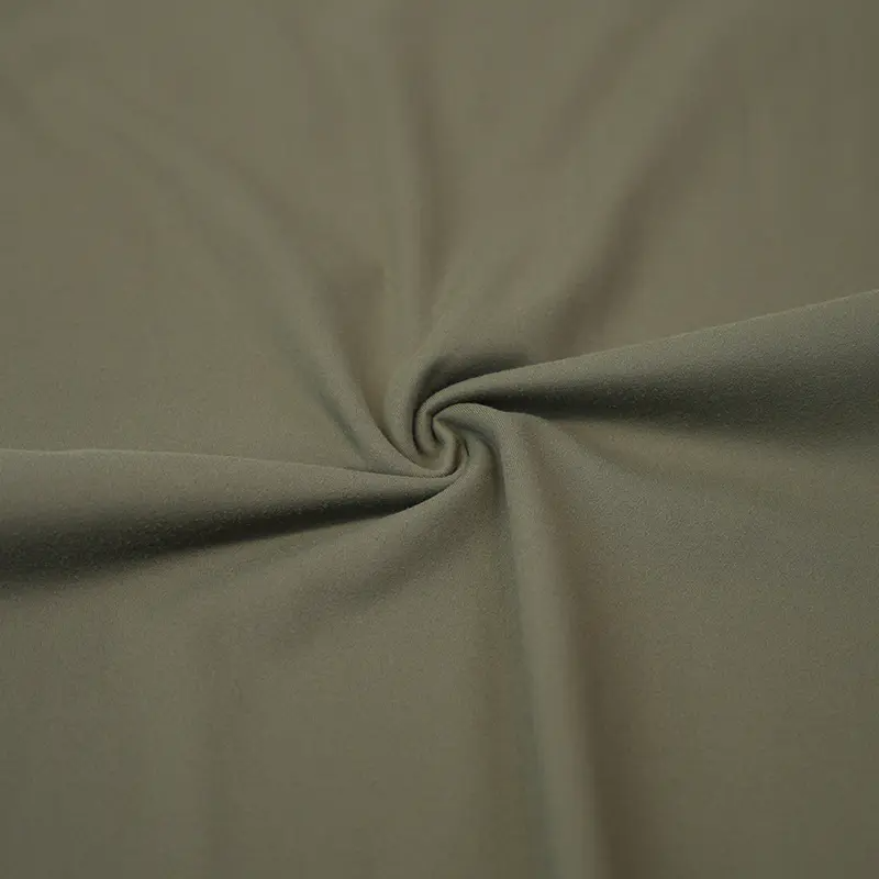 Hvad er nylon spandex sammenkoblet stof, og hvordan er det anderledes end andre typer strikstoffer?